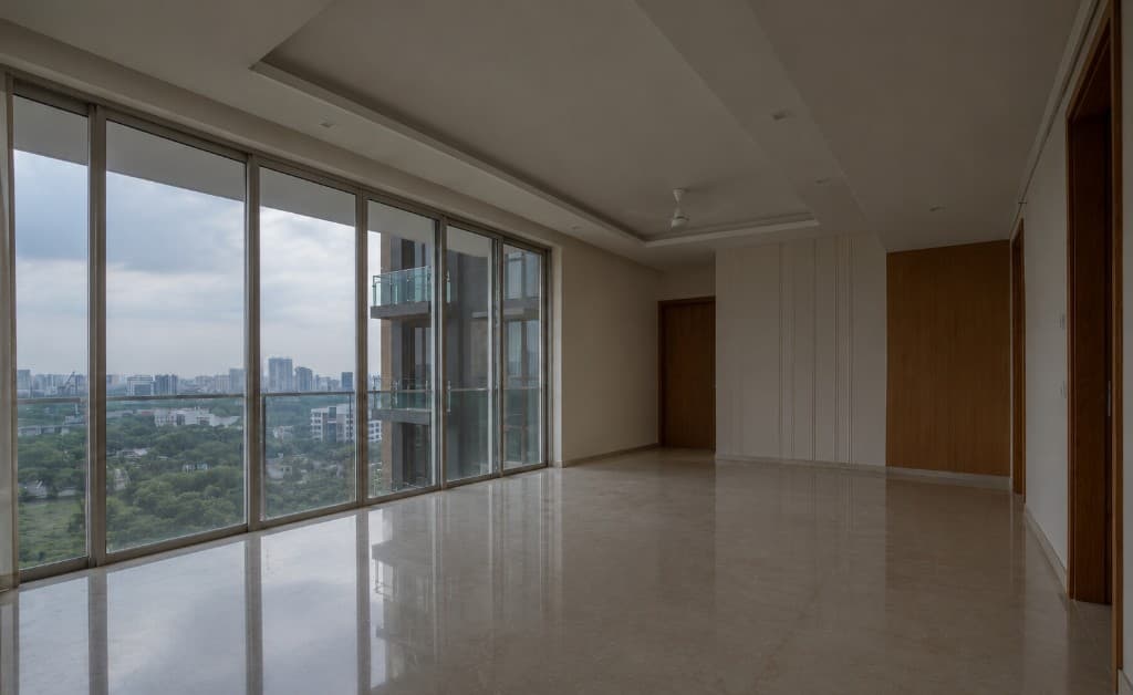 Empty living room with bare walls and no furniture